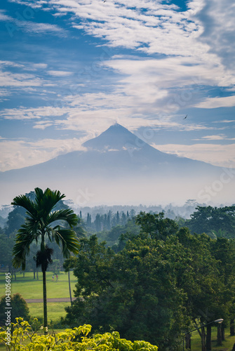 Merapi volcano as seen from the ancient buddhist temple of Borobudur in Central Java, Indonesia.