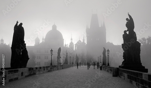 Fotografering Praugue - Charles bridge in the momring fog.