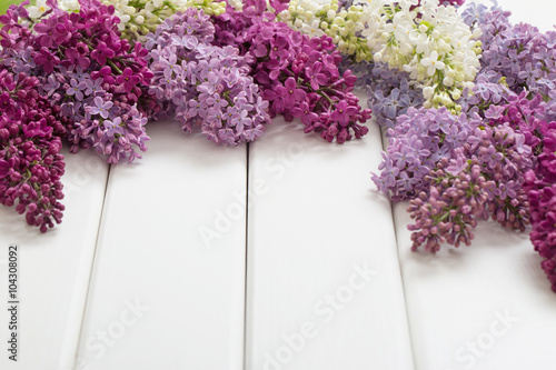 The beautiful lilac on a wooden background