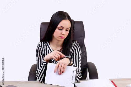 Busy business woman checking the time