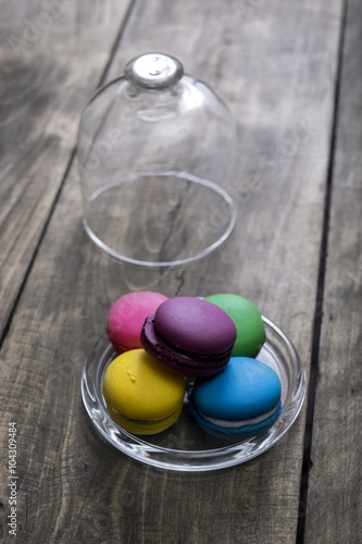 Colorful macaroons on wooden background