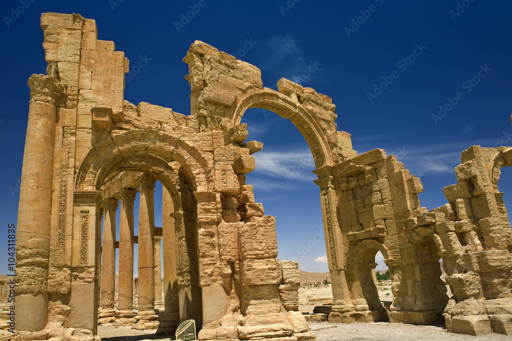 Syria. Palmyra (Tadmor). The monumental arch (gateway) and colonnade. This site is on UNESCO World Heritage List
