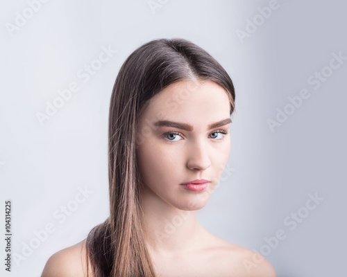 Portrait of beautiful girl with brown hair 