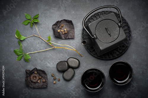 Black cast iron tea set. various tea in Asian style
