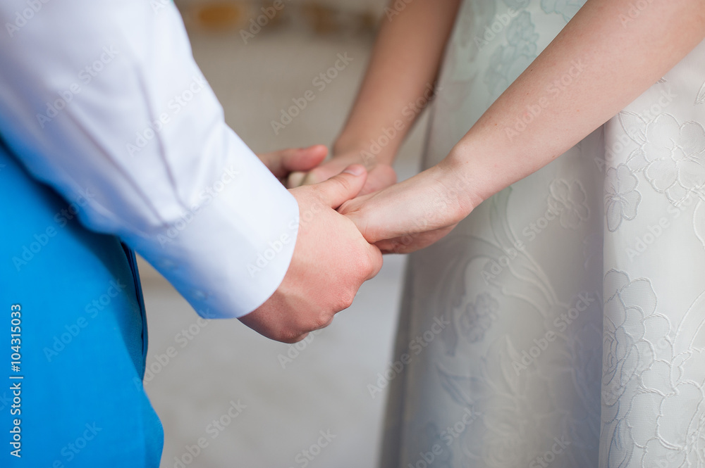 Bride and groom holding hands