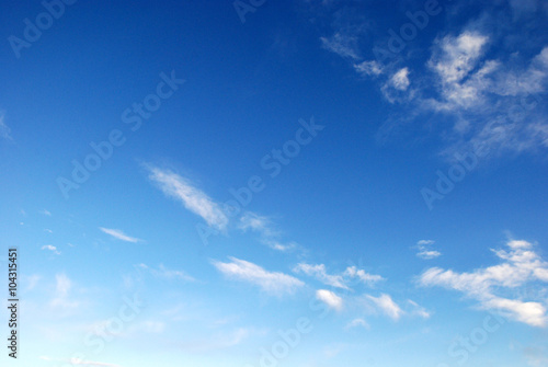 white clouds in the pure blue sky background
