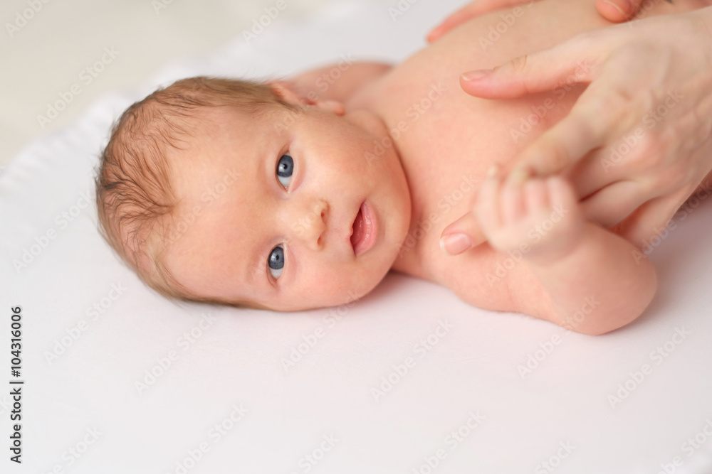 One month old newborn baby with mother One month old newborn baby with mother