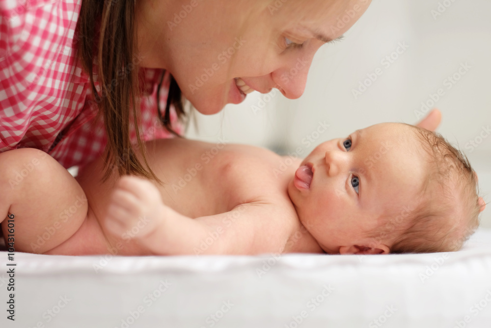 One month old newborn baby with mother One month old newborn baby with mother