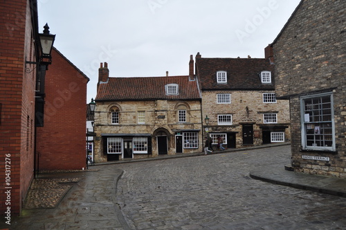  showing traditional cobbled streets and distinctive architecture in the picturesque old town of Lincoln in the U.K.