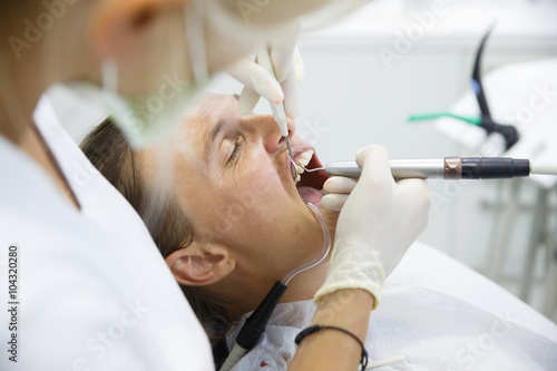 Obraz na płótnie Patient getting her gum pocket depth measured w salonie
