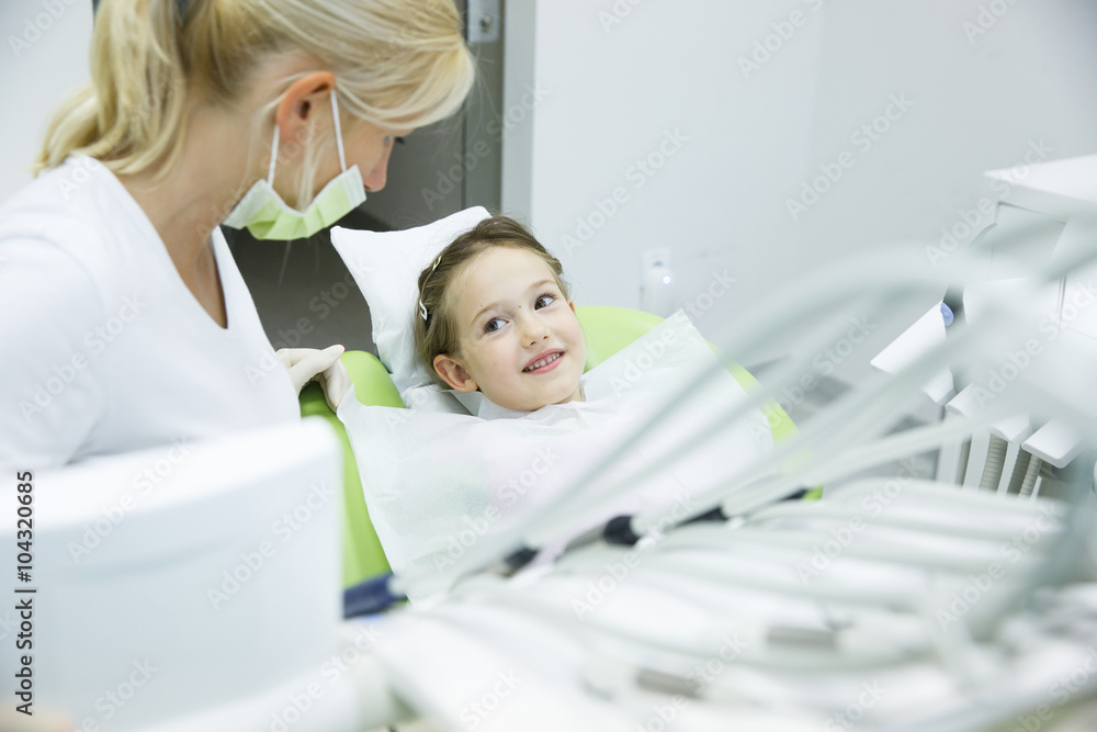 Little patient conversing with her dentist Little patient conversing with her dentist