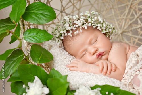 Little newborn girl 11 days, sleeps. Beautiful newborn girl and