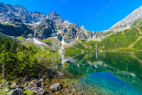 Fototapeta Naklejka Na Ścianę i Meble -  Green water of Morskie Oko lake in summer, Tatra Mountains, Poland