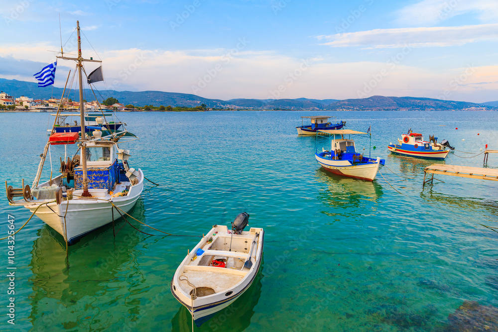 Fishing boats anchoring in bay on coast of Samos island, Greece