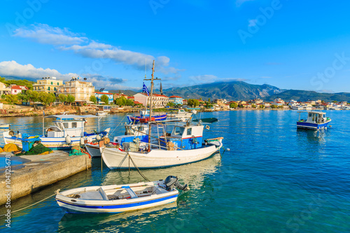 Greek fishing boats at sunrise in small port  Samos island  Greece