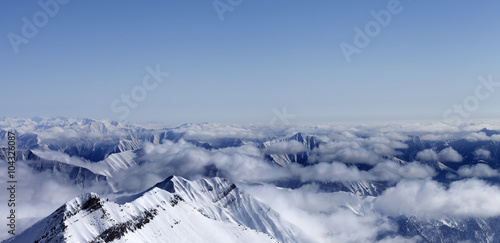 Panoramic view on high mountains in haze