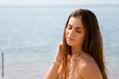 Thoughtful girl on the beach