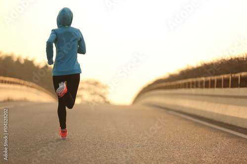 young fitness woman runner athlete running at road © lzf