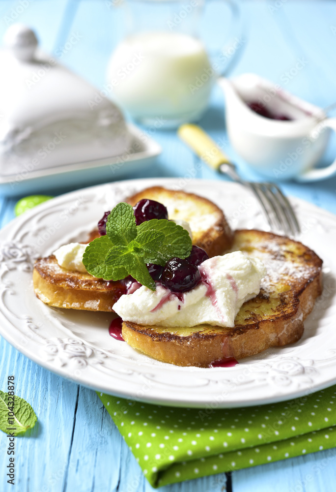 French toasts with ricotta and cherry syrup. French toasts with ricotta and cherry syrup.