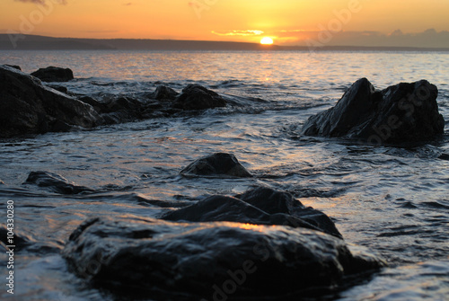 Cornwall sunrise across the rocks and sea