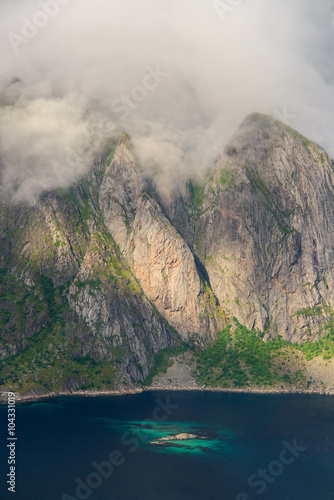 Beautiful views of the mountains in clouds near water. Lofoten, Norway photo