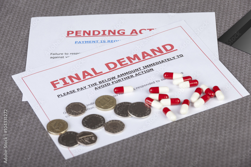 Final demands on a table with cash and pills Final demands on a table with cash and pills
