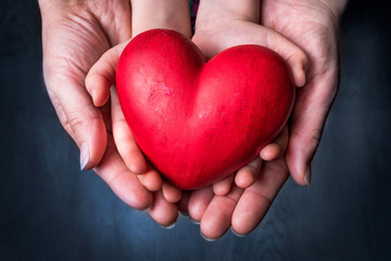 Red Heart on Palm of Woman and Child - Mother Day Symbol