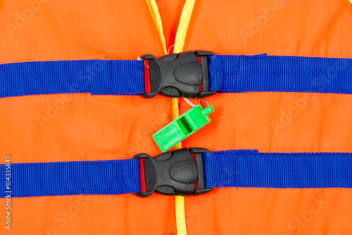 Green whistle on part of life jacket
