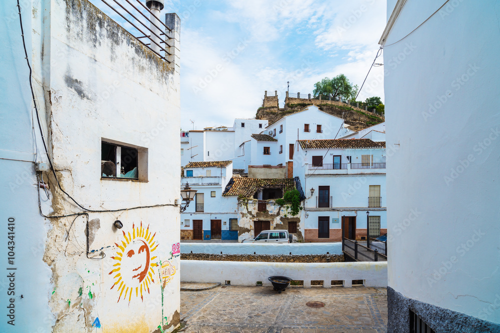 Fototapeta premium Setenil de las Bodegas is a town in the province of Cadiz, Spain, famous for its dwellings built into rock overhangs above the Rio Trejo. Andalusia. Spain