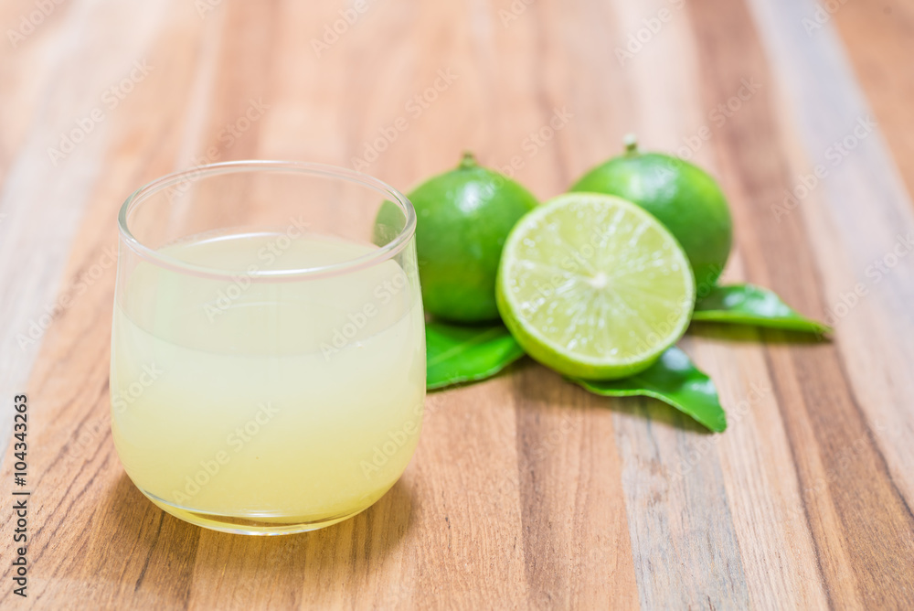 glass of lime juice with slice and leave glass of lime juice with slice and leave