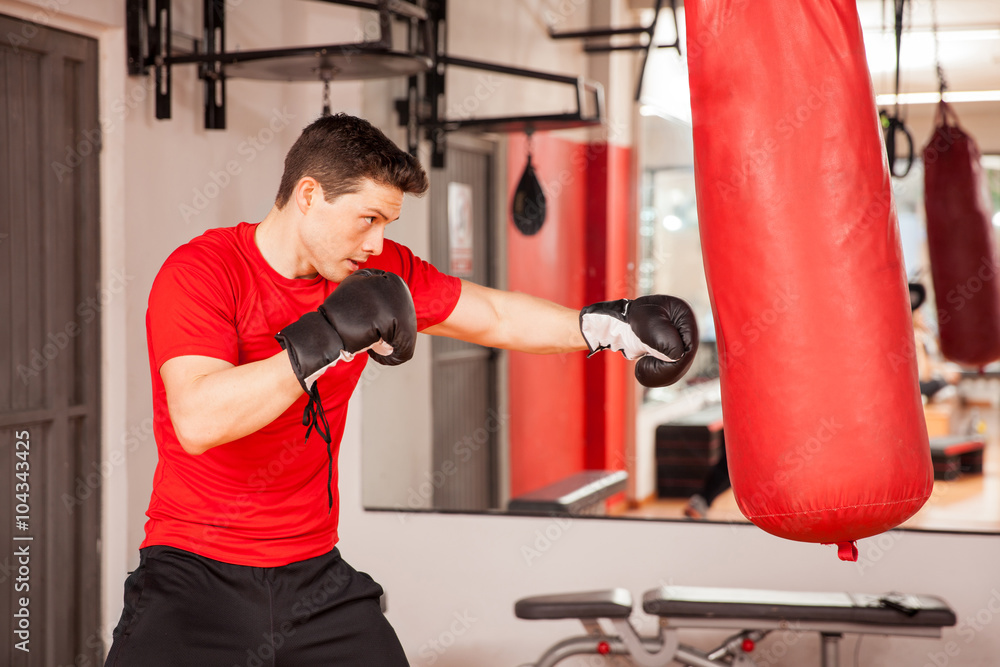 Young man practicing on a punching bag