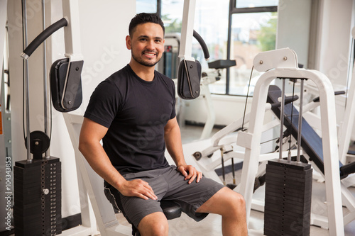 Handsome man taking a break at the gym