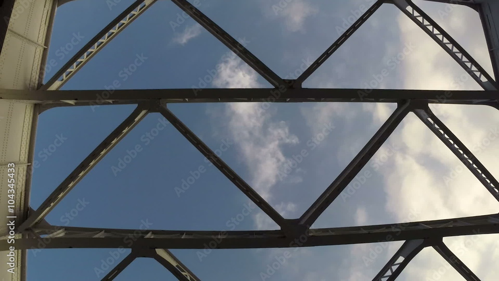 Roof view from a car through futuristic structures in blue skies. Roof view from a car through futuristic structures in blue skies.