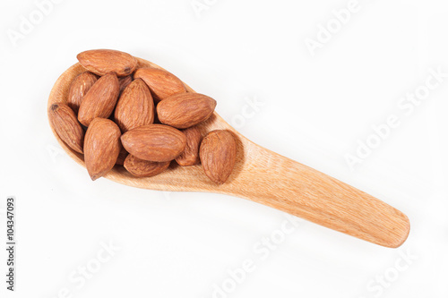 almonds on wood spoon