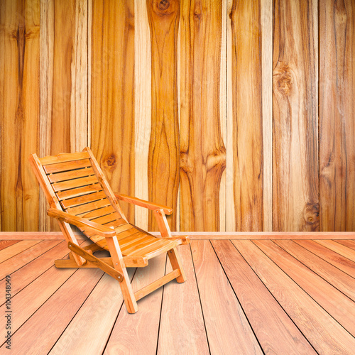 wooden deck chair in retro style on wooden floor interior