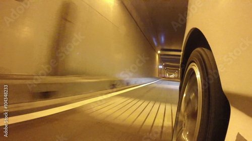 Front wheel variation of a car running through the nightscape of Tokyo and Rainbow Bridge.