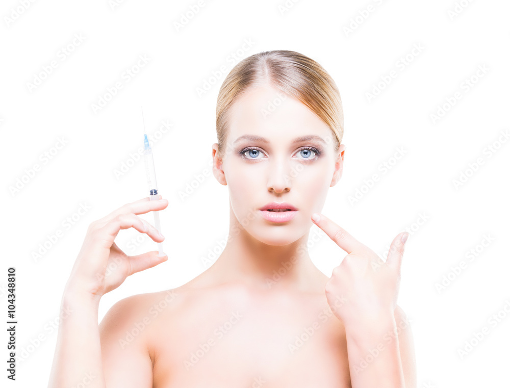 Young woman holding a syringe in her hands and injecting botox into smooth skin. Young woman holding a syringe in her hands and injecting botox into smooth skin.