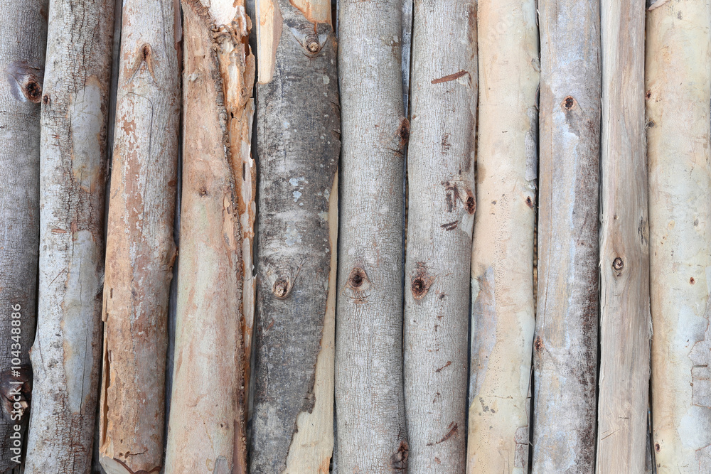 firewood in concatenation to wood background. firewood in concatenation to wood background.
