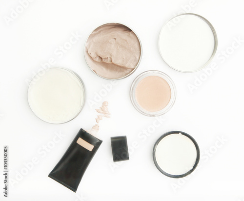 Top view of different cosmetics products on the white background
