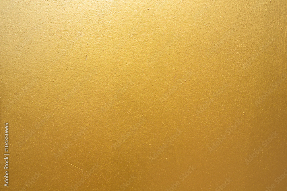Naklejka premium Gold concrete wall on background texture.
