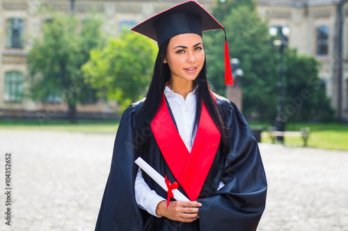 Happy woman portrait on her graduation day smiling