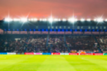Blurry de-focused stadium football  twilight background.