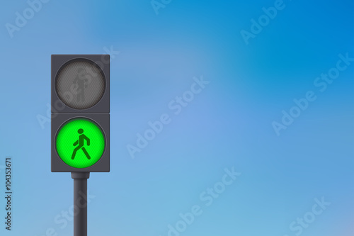 Pedestrian Traffic Light. Green light on. Sky background