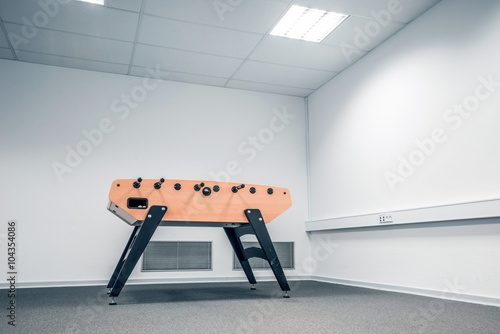 Foosball table in a large room photo