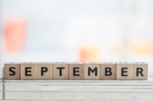 September sign on a wooden table