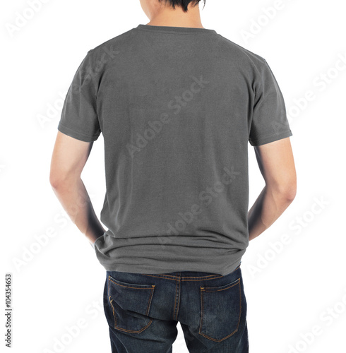 Close up of man in back grey shirt on white background.