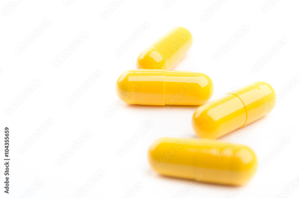 yellow capsules isolated yellow capsules isolated