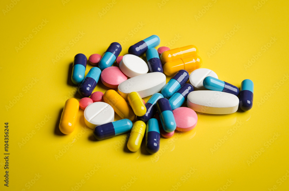 pile of colorful pills pile of colorful pills