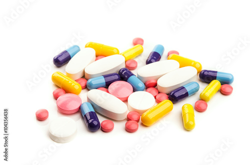 pile of colorful pills isolated photo