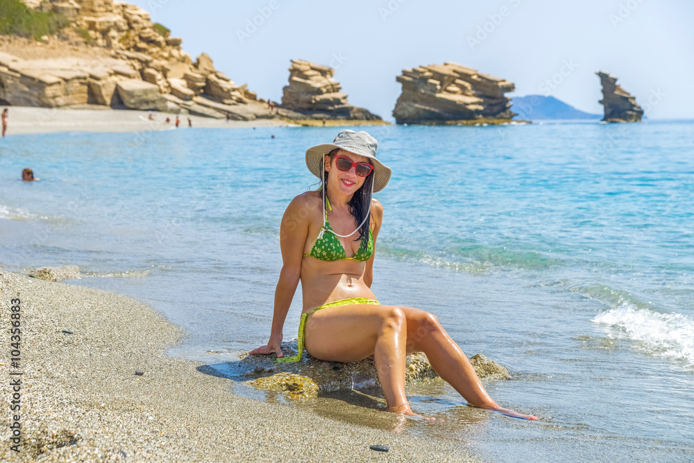 Fototapeta premium Young pretty woman in one of the most beautiful beaches in the w